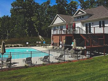 Outdoor swimming pool and deck at Riverwood.
