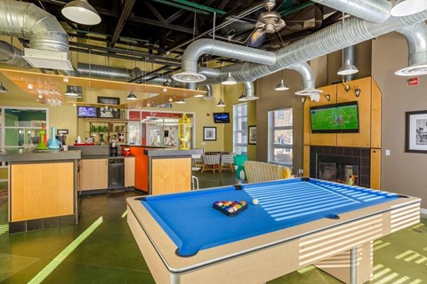 a game room with a pool table and a tv at Village Club of Royal Oak, Michigan, 48067