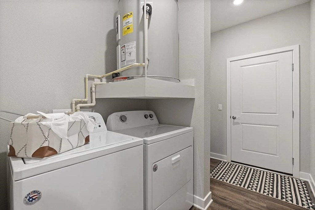 a washer and dryer in a laundry room with a door