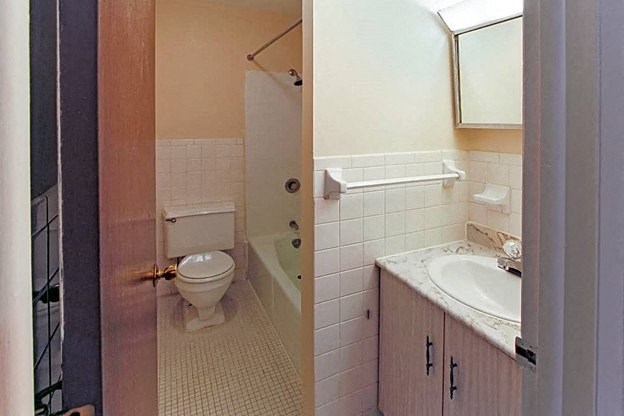 a bathroom with a toilet sink and bathtub