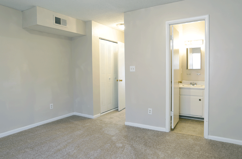 Bedroom leading to hallway and bathroom