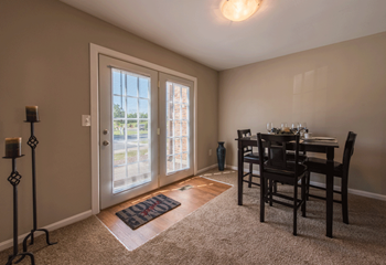 Dining room with table next to patio doors - Photo Gallery 6