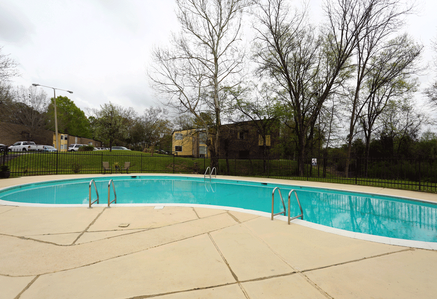 Outdoor sparkling swimming pool with expansive sundeck.