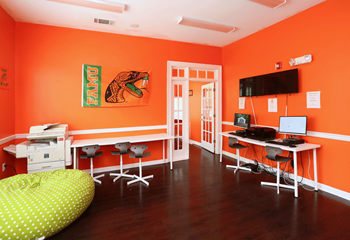 Resident lounge area with TV and barstools - Photo Gallery 4