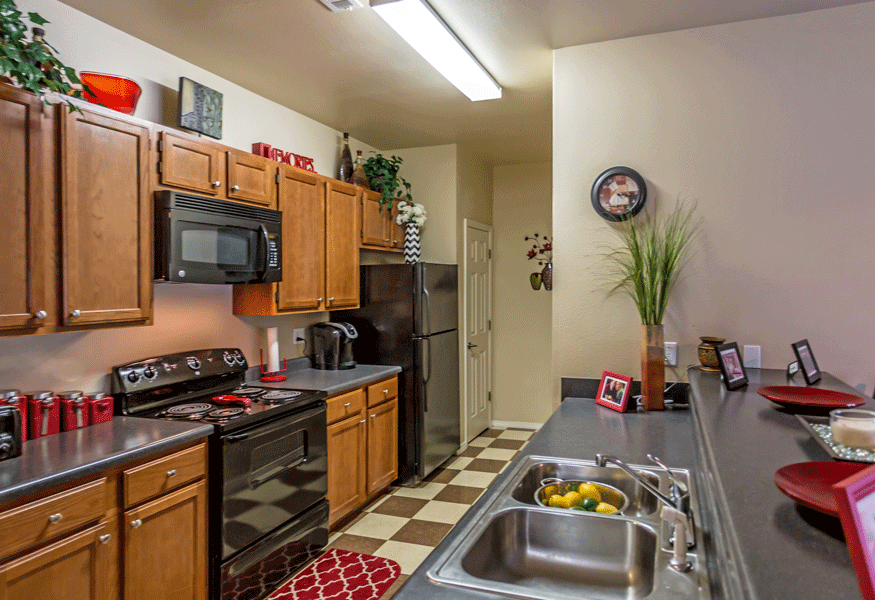 Kitchen area with black appliances