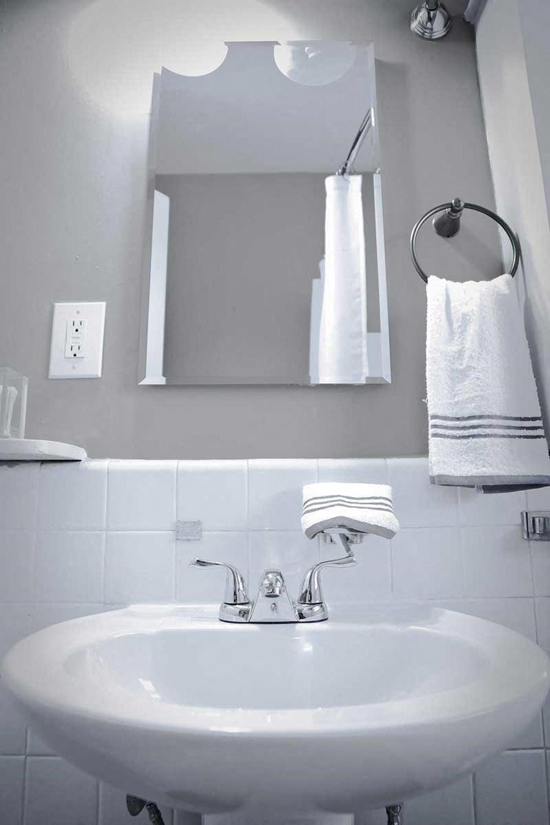 Modern bathroom with pedestal sink.