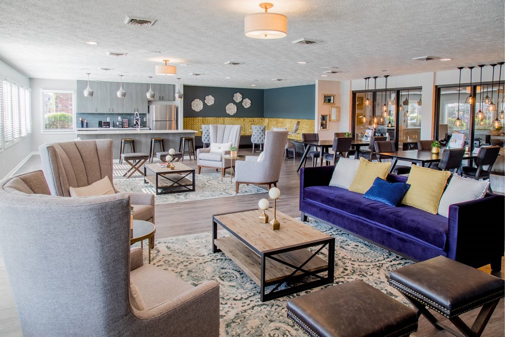 A living room with a blue couch and a coffee table.