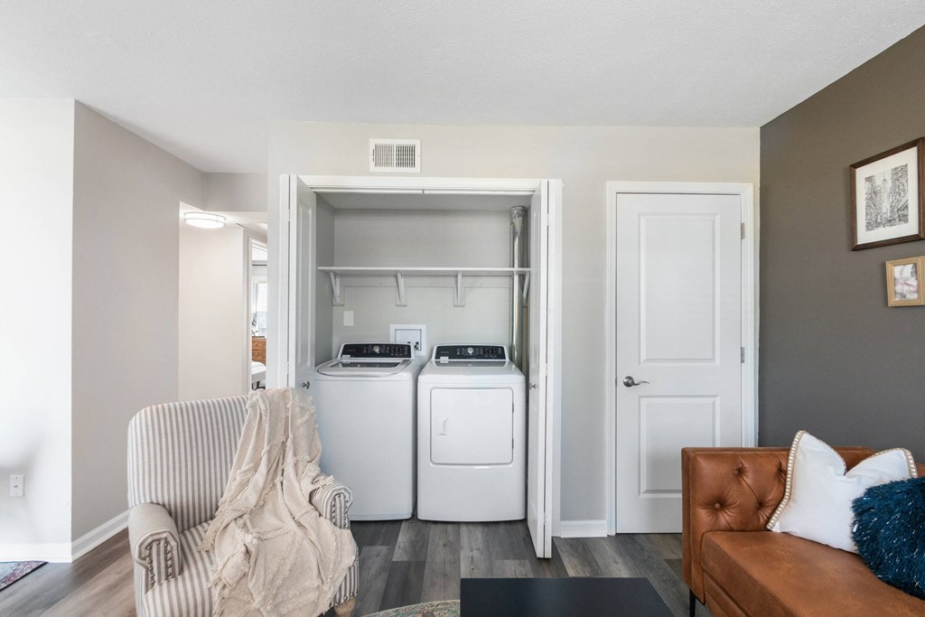 A laundry room with a washer and dryer in a home.