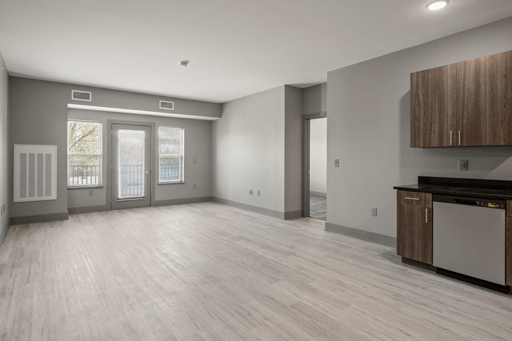 the living room and kitchen in a new home