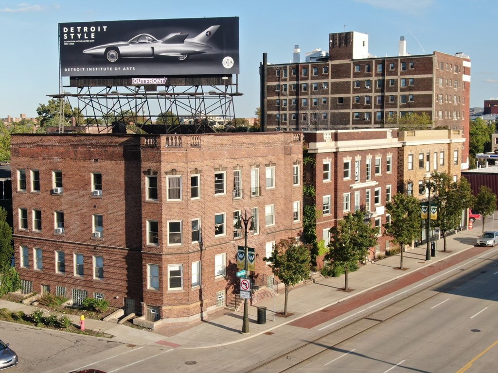 a billboard advertising a car on top of a building