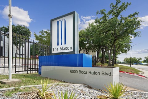 The Mason sign is blue and white with a large M on it.