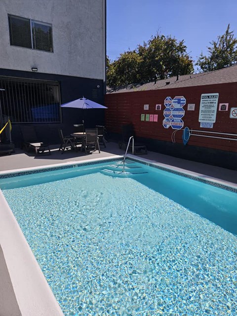 a swimming pool in front of a building