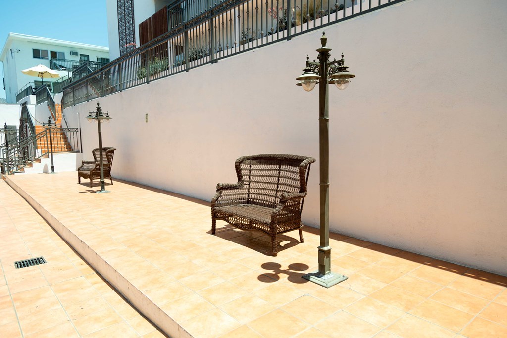 bench in common area with outdoor lamps