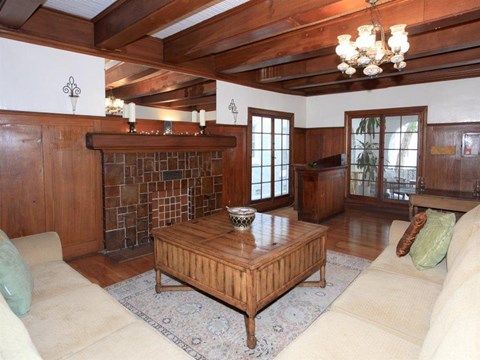 the living room has a fireplace and a wooden coffee table