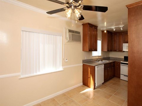 a kitchen with a ceiling fan and a sink