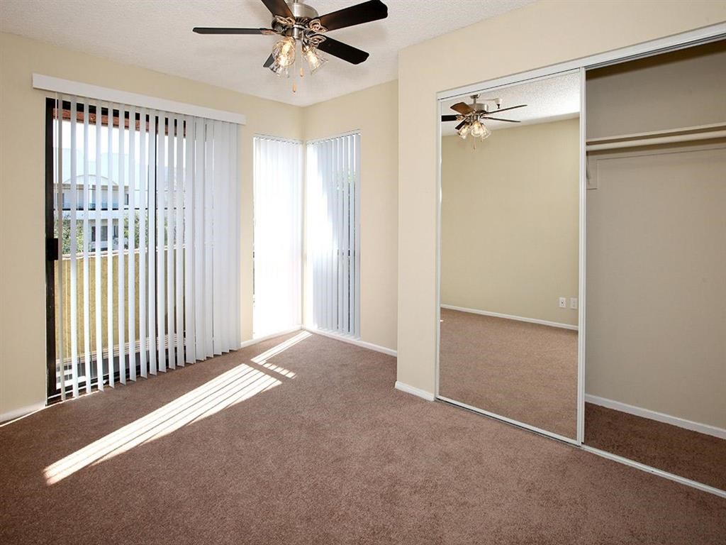 Bedroom with carpet and ceiling fan