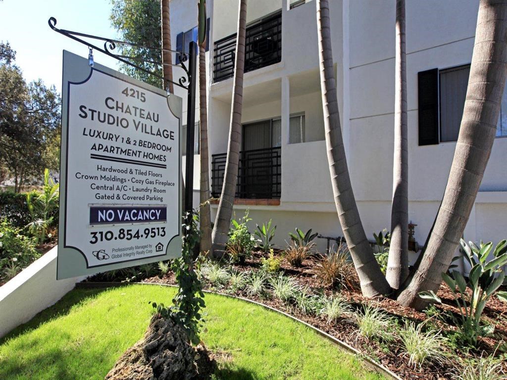 Front of building with leasing sign