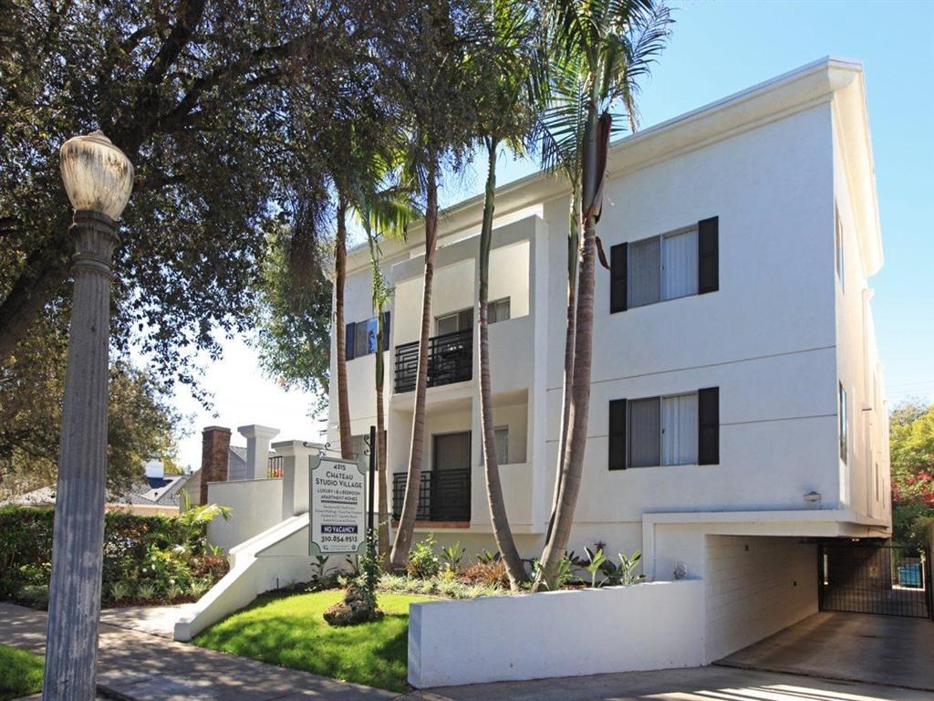 front of the building with windows and trees