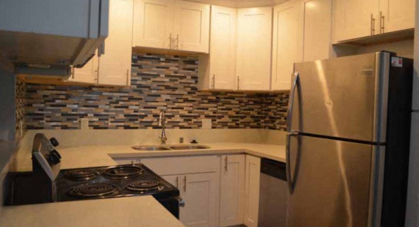 a kitchen with a stove and a refrigerator