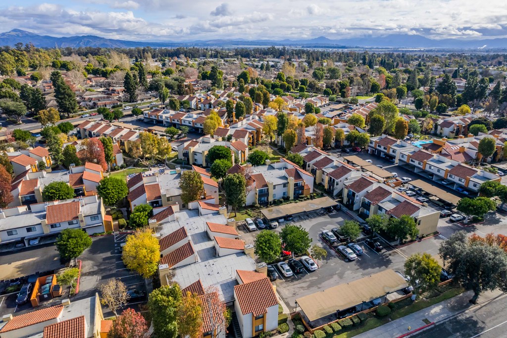 an aerial view of a neighborhood with houses and cars