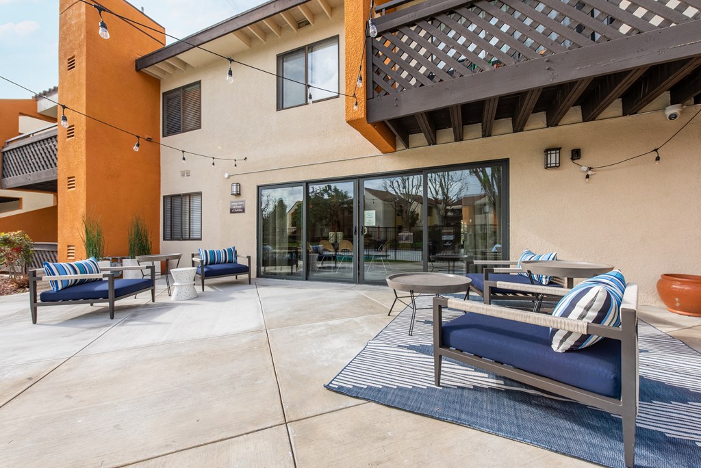 Resident lounge exterior seating area with string lighting