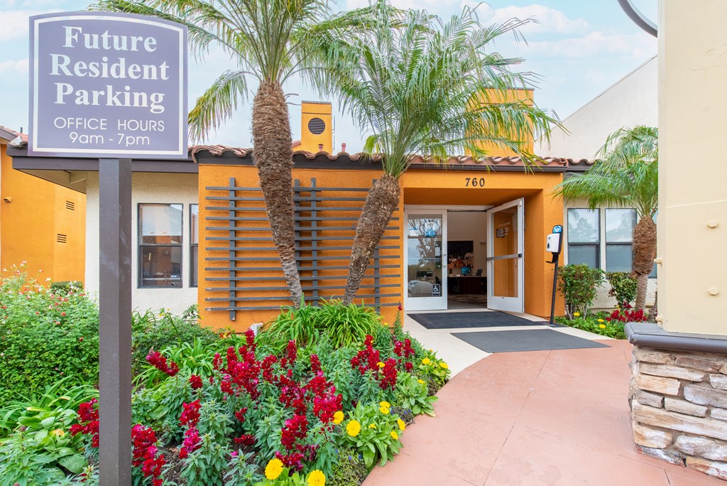 Leasing office entry with lush landscaping