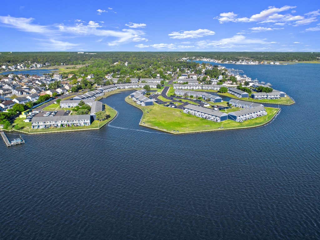 an aerial view of a city on a body of water