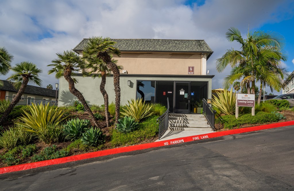 a building with palm trees in front of it