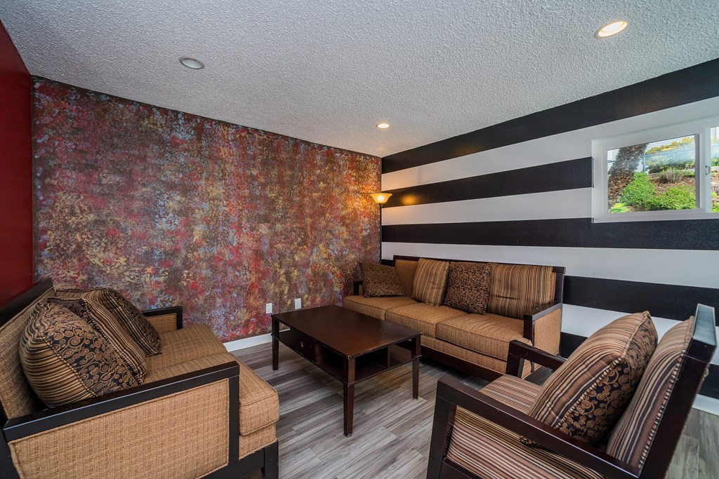 a living room with couches and a table