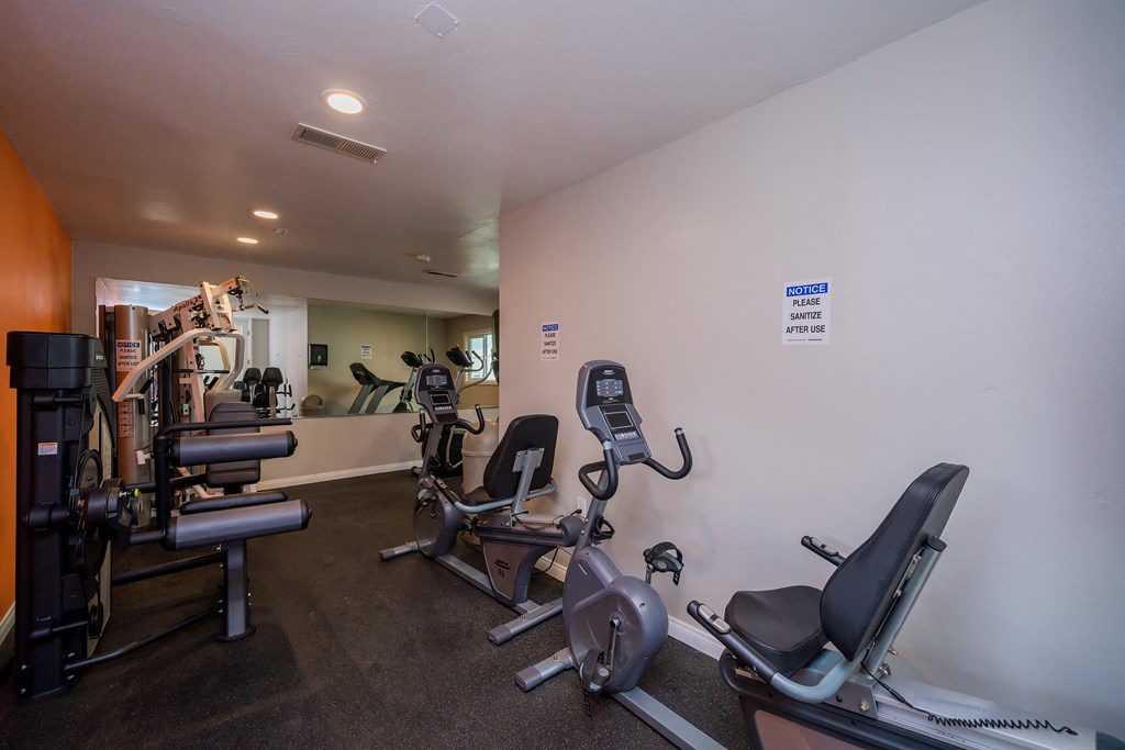 private gym with cardio equipment at the district flats apartments in lenexa