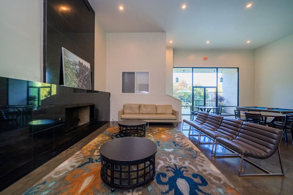 A living room with a fireplace and a couch.