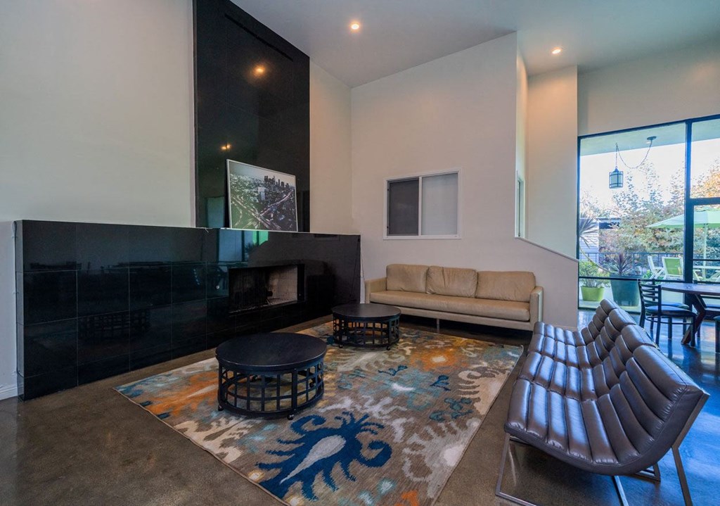 A living room with a fireplace and a couch.