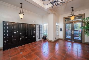 A room with a black cabinet and a brown floor.