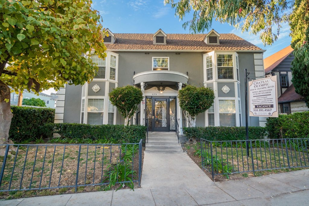 A building with a sign that says "CAPITAL OLYMPICS" is shown.