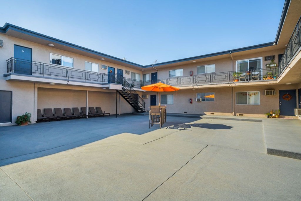 our apartments have a large courtyard with seating and a fire pit