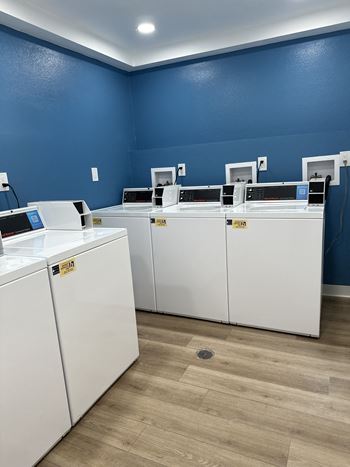 A laundromat with washers and dryers.