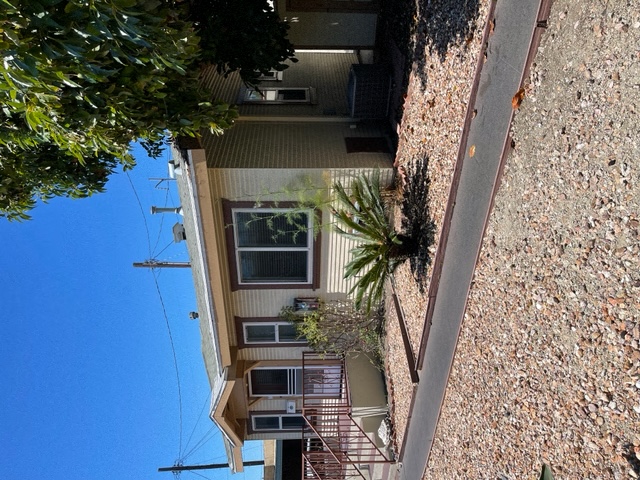 Entrance of building with walkway and garden