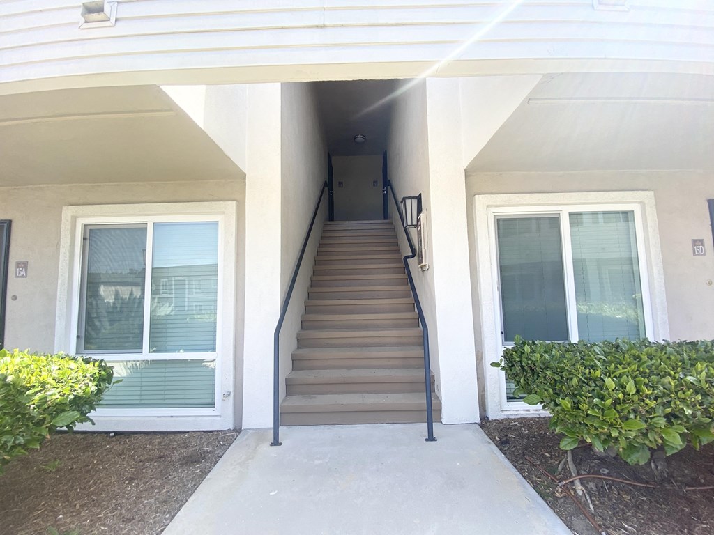 the stairway up to the front door of an apartment building
