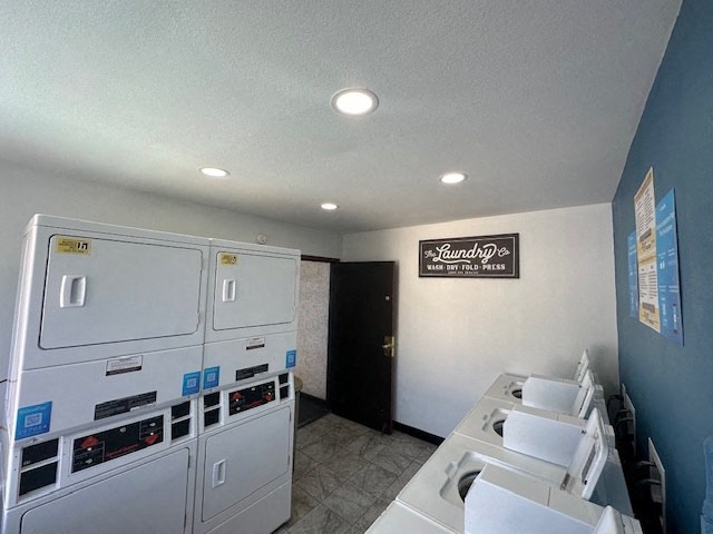 a kitchen with white appliances and a counter top