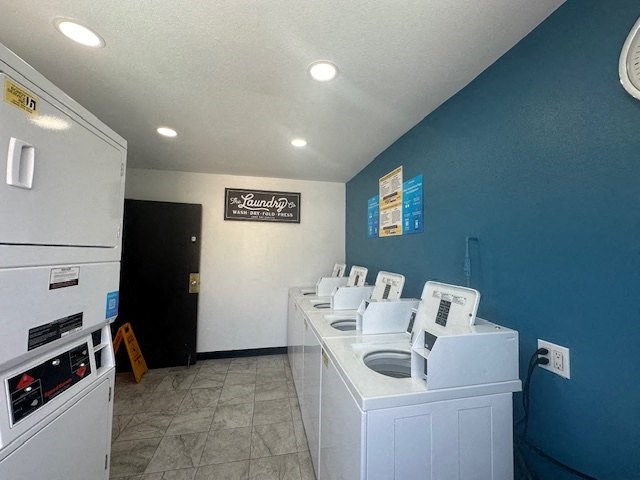 a laundry room with a bunch of washing machines