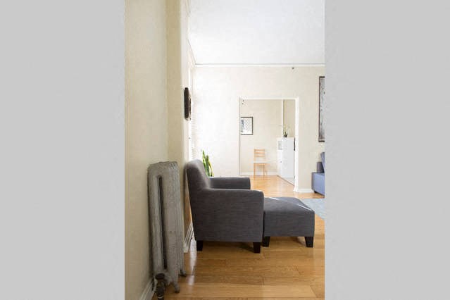 a living room with with a couch and furnace