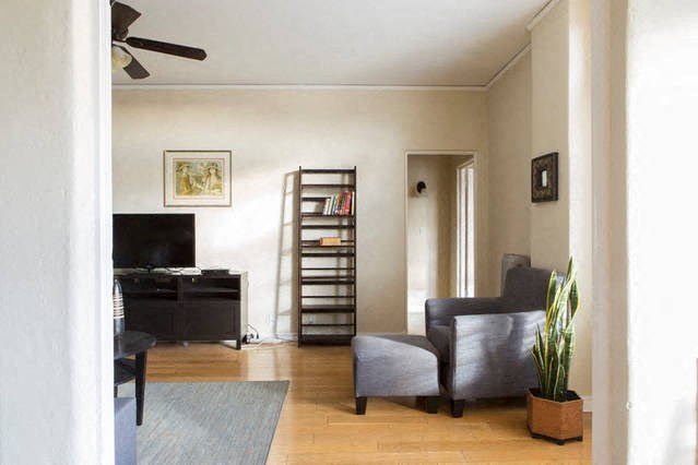 a living room with a couch and a tv in it
