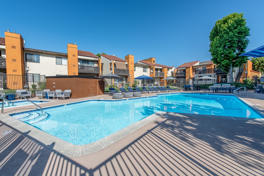 Wide angle view of the pool with buildings in the backdrop