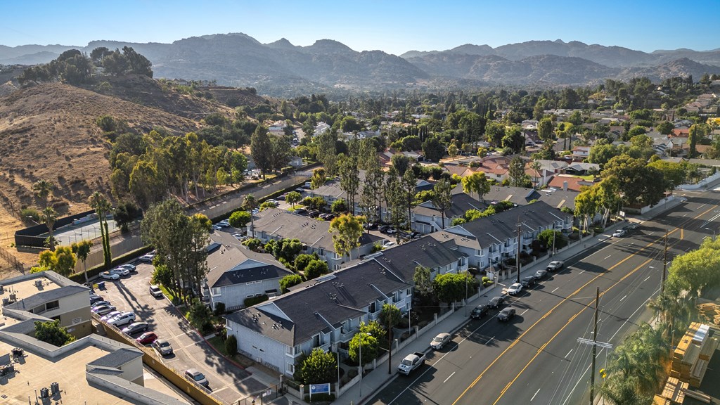 A residential area with houses and a road.