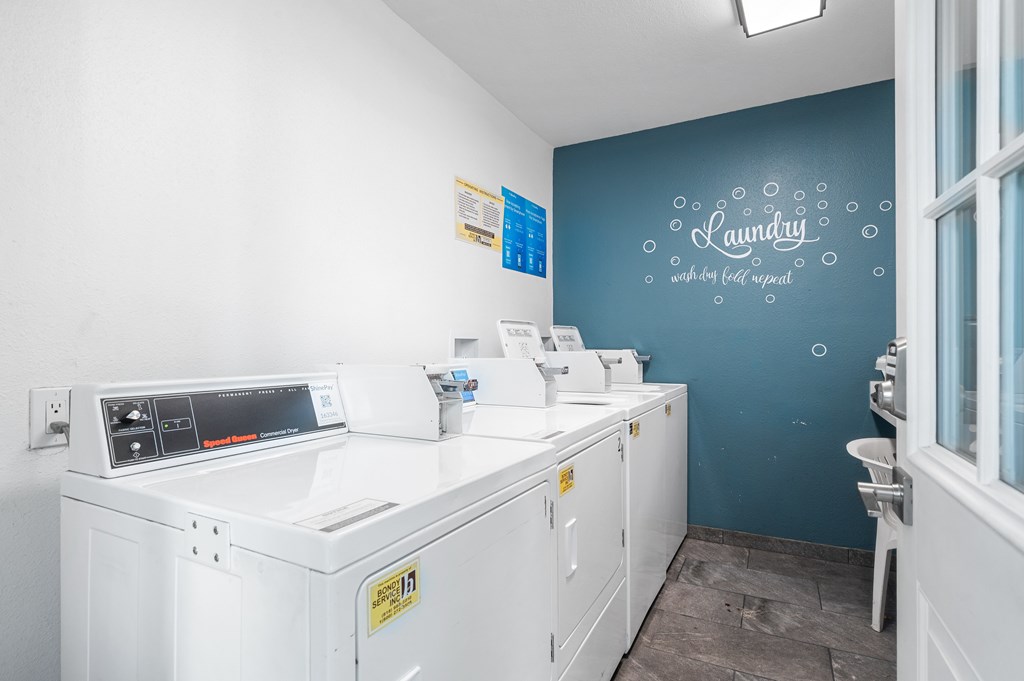 A laundry room with a washing machine and a dryer.
