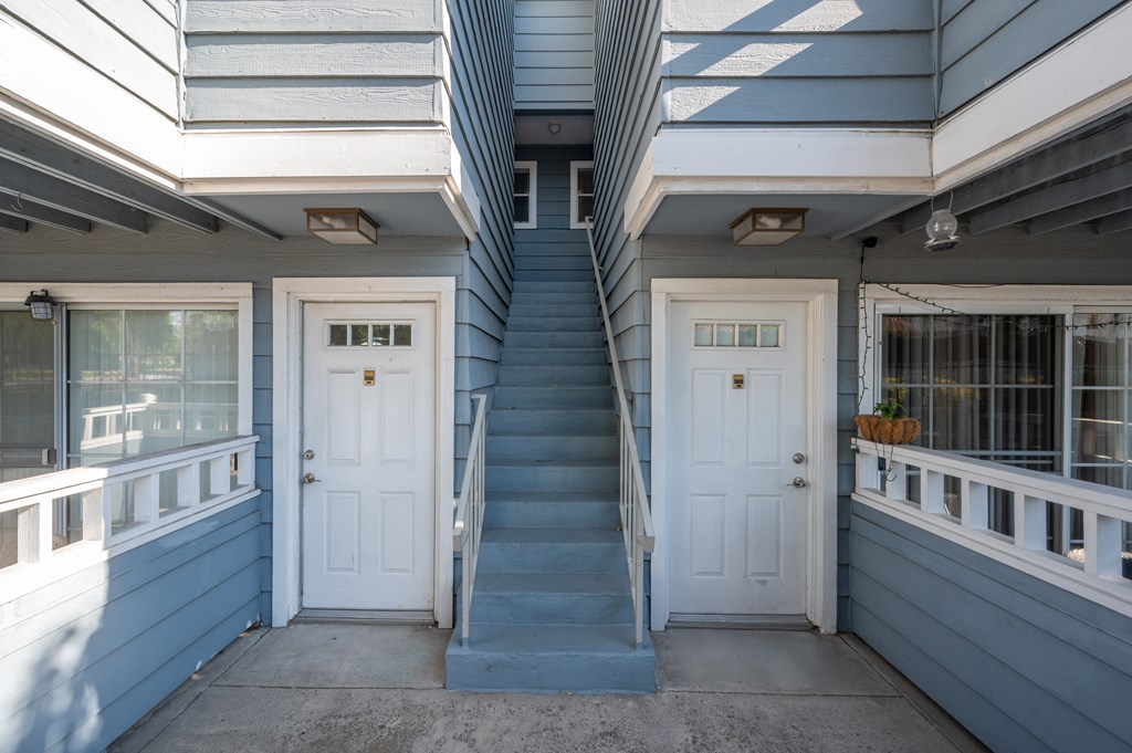 Picture of 2 white door to 2 separate residences