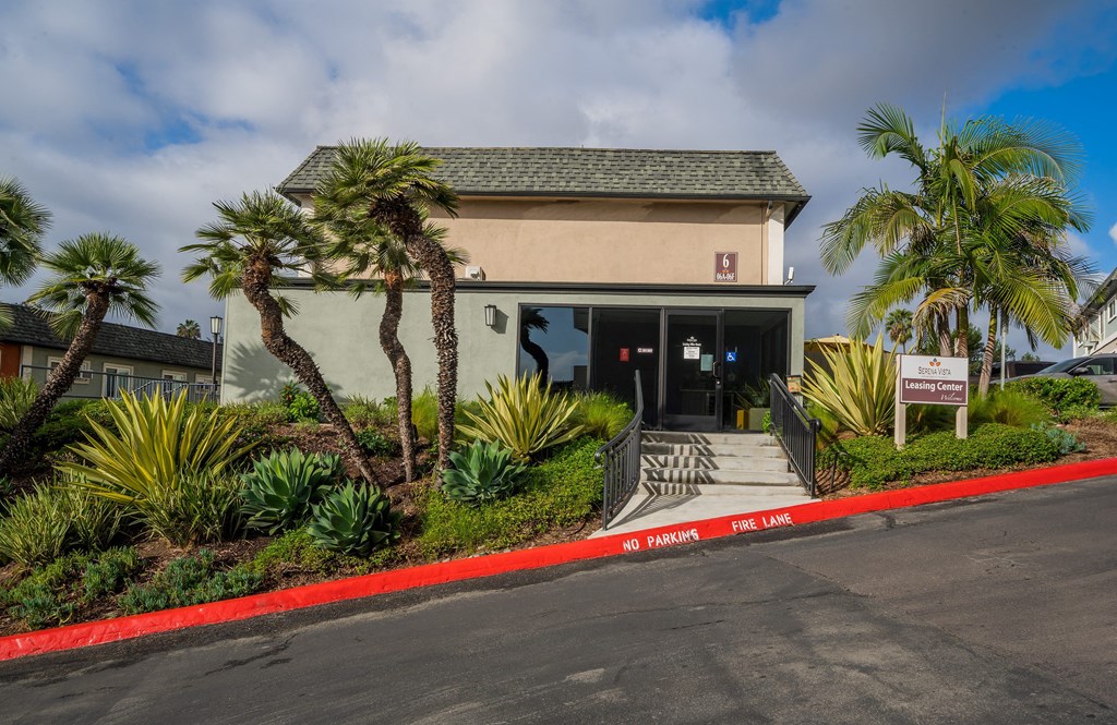 a building with palm trees in front of it