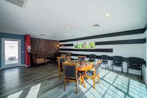 a large dining room with a table and chairs