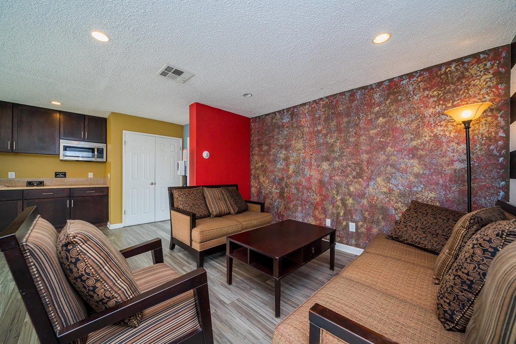 a living room with couches and chairs