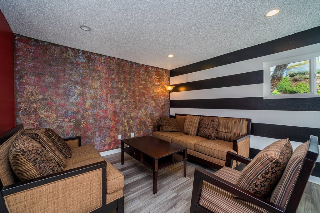 a living room with couches and a coffee table